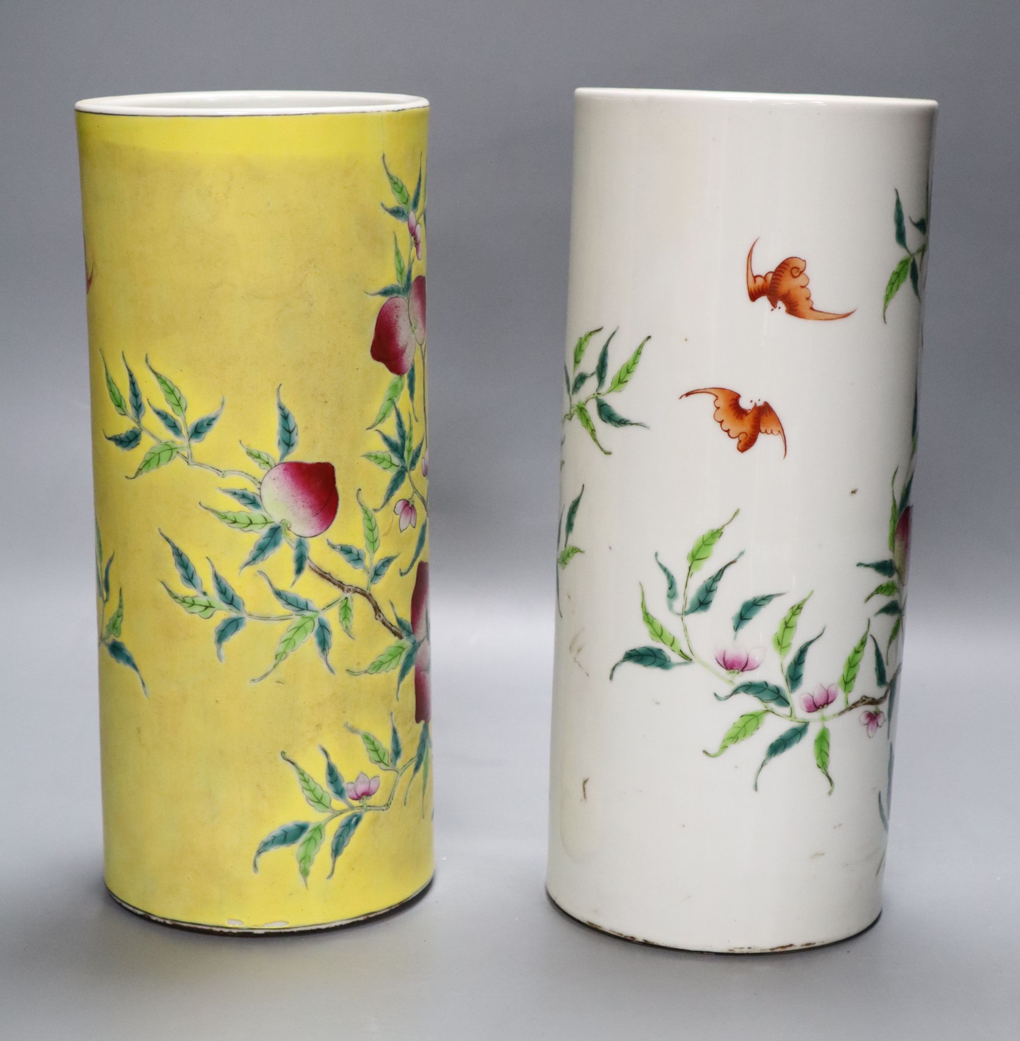 Two Chinese peaches and bats famille rose cylindrical vases, height 29cm